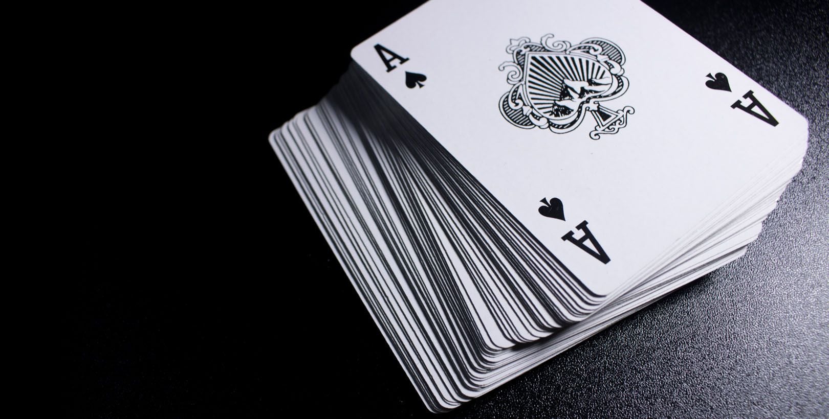 Ace of spades playing card on deck showing professional card printing and game materials