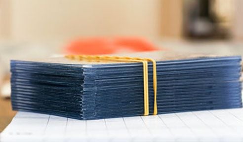 Trading card top loader protectors stack showing card storage and preservation solutions