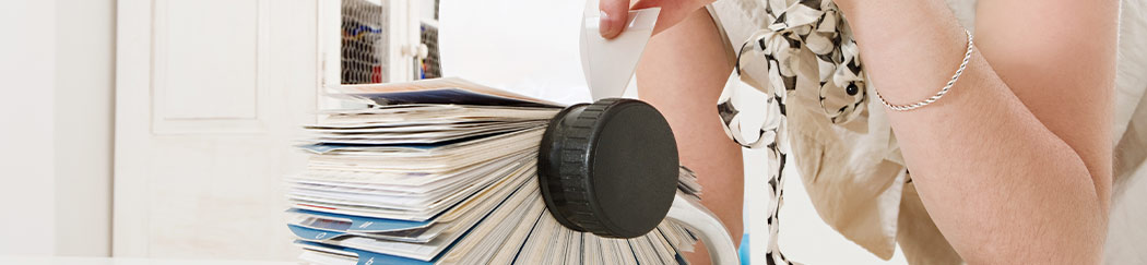 lady looking at business cards on a large wheel