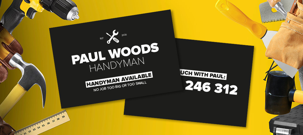 Black business card on yellow background with tools