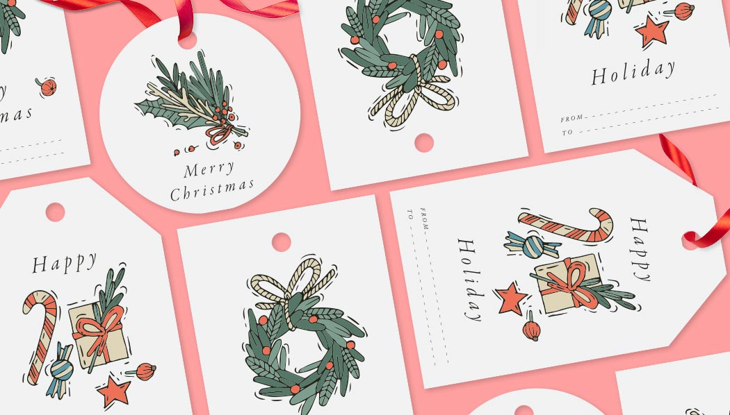 Christmas tags in a variety of shapes: standard rectangle, luggage, circle, and pointed