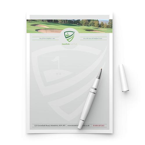 A custom branded letterhead displayed with a pen resting on top, showcasing the professional design and logo.