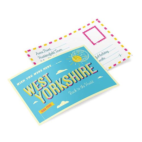 Two identical premium postcards, one showcasing the front with a bold "Welcome to West Yorkshire" design, and the other revealing the postcard rear