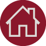 A circular maroon icon featuring a white outline of a simple house with a triangular roof, representing in-house design & print.